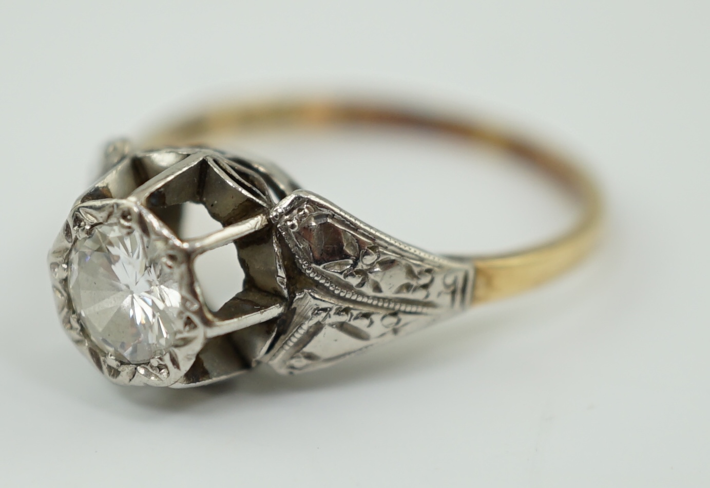 An 18ct gold, platinum and illusion set solitaire diamond ring